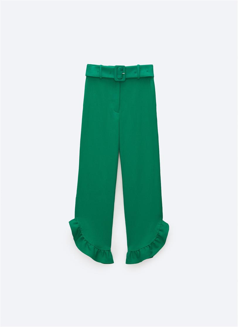 Pantalón verde con volante de Uterqüe, 79€