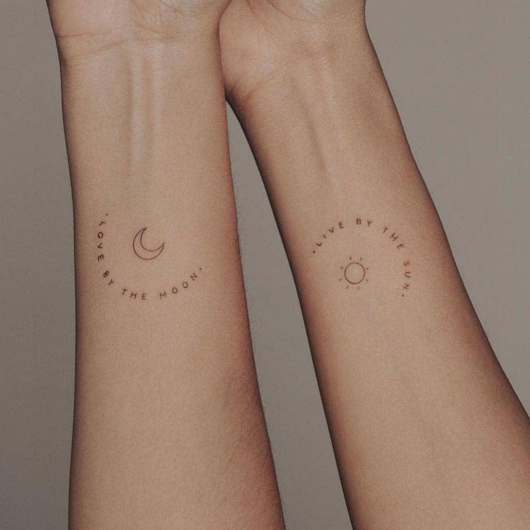 Tatuajes de sol y luna en los antebrazos